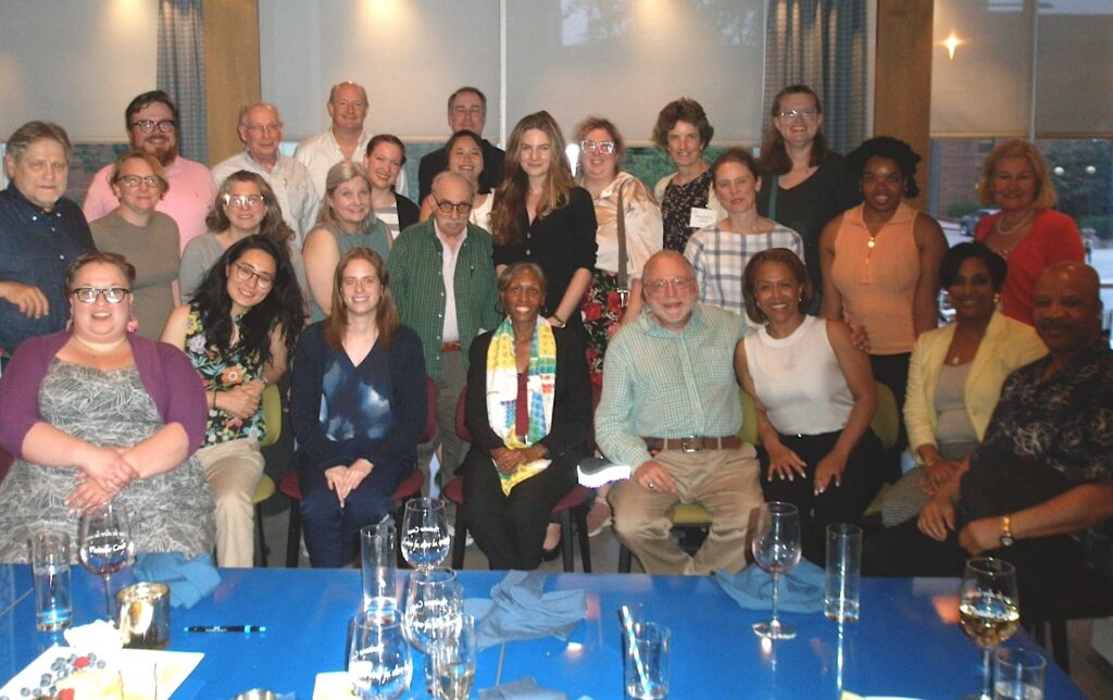 group of men and women at a conference