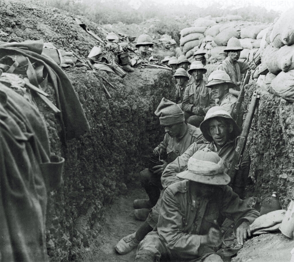 black and white photo of a group of soldiers standing and sitting