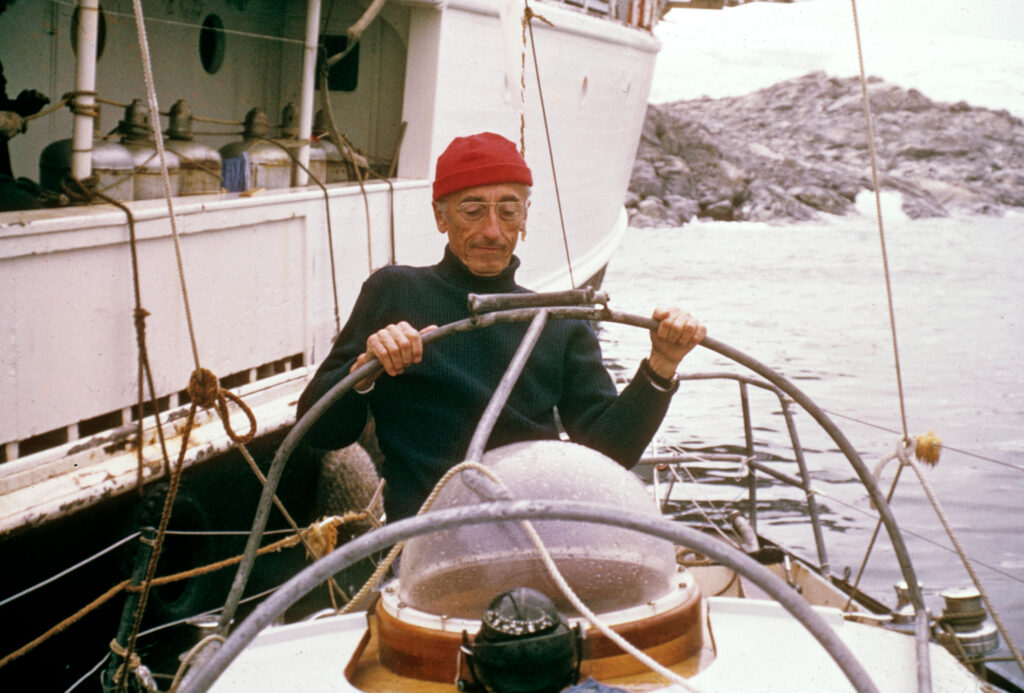 An older man on the deck of a ship