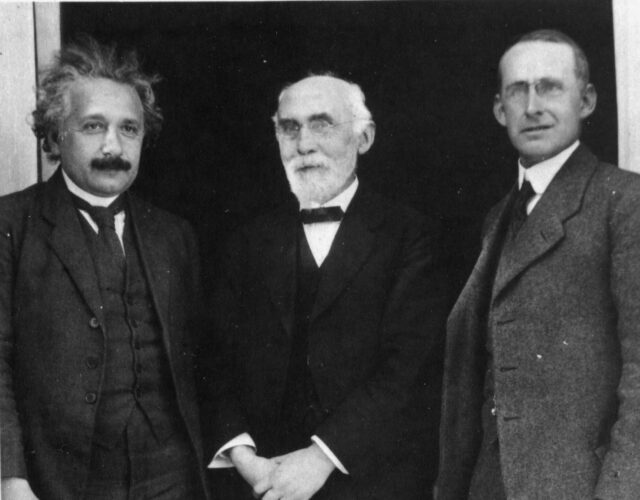 Albert Einstein, Hendrik Lorentz and Arthur Eddington standing outdoors