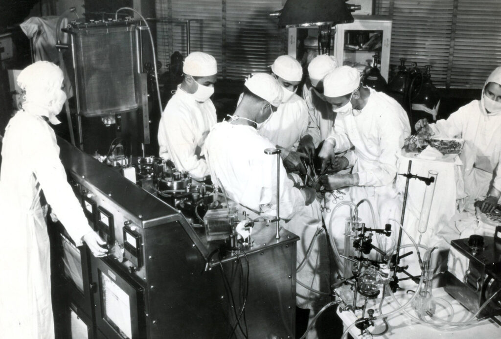 Black and white photograph of busy surgical scene