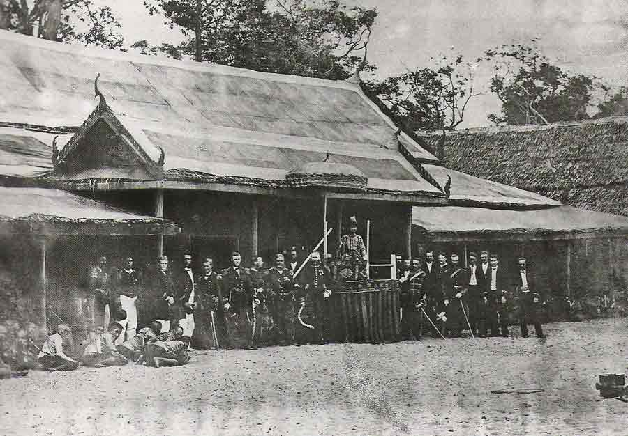 Old black and white photo a group of people in front of a building