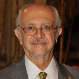 man dressed in a suit with a yellow tie