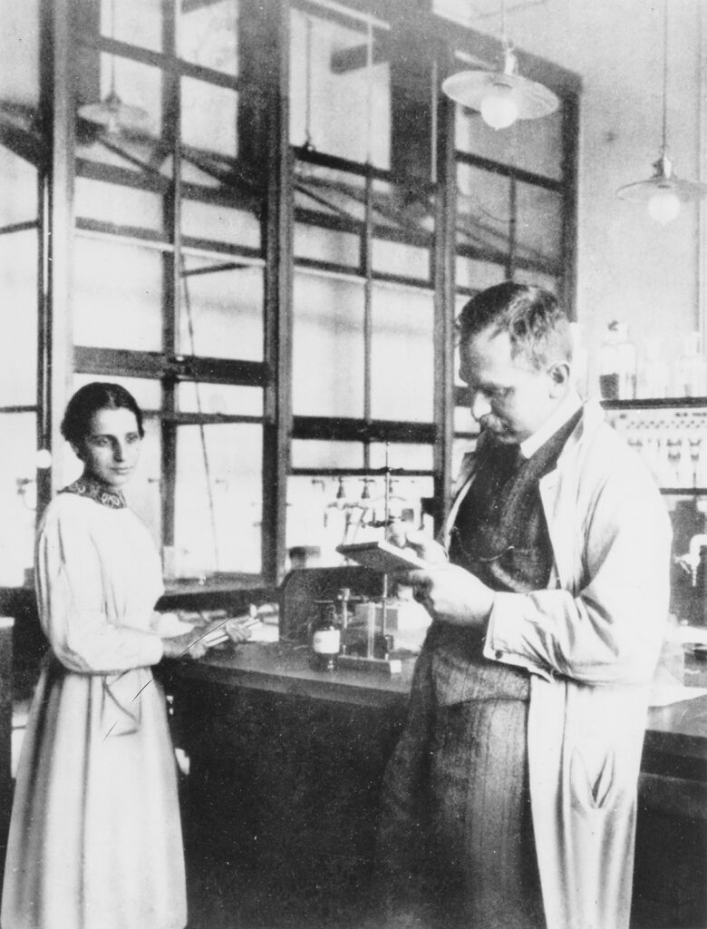 Black and white photo of man and woman in a lab