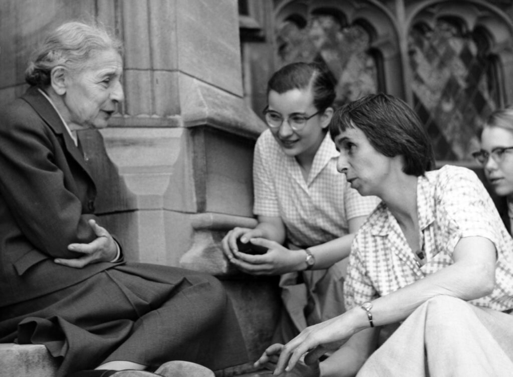 Photo of women seated on steps