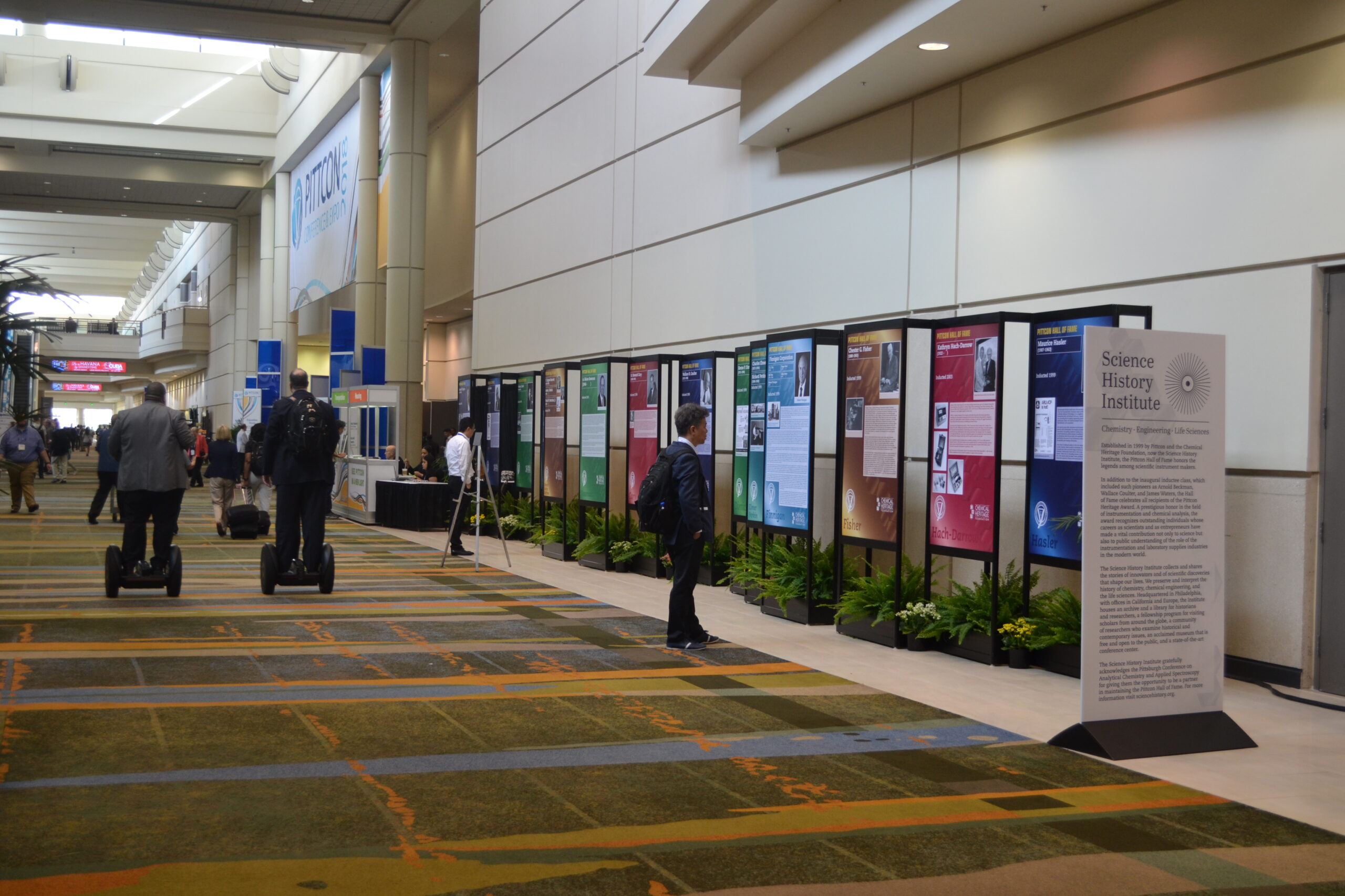 Pittcon Hall of Fame display with visitors