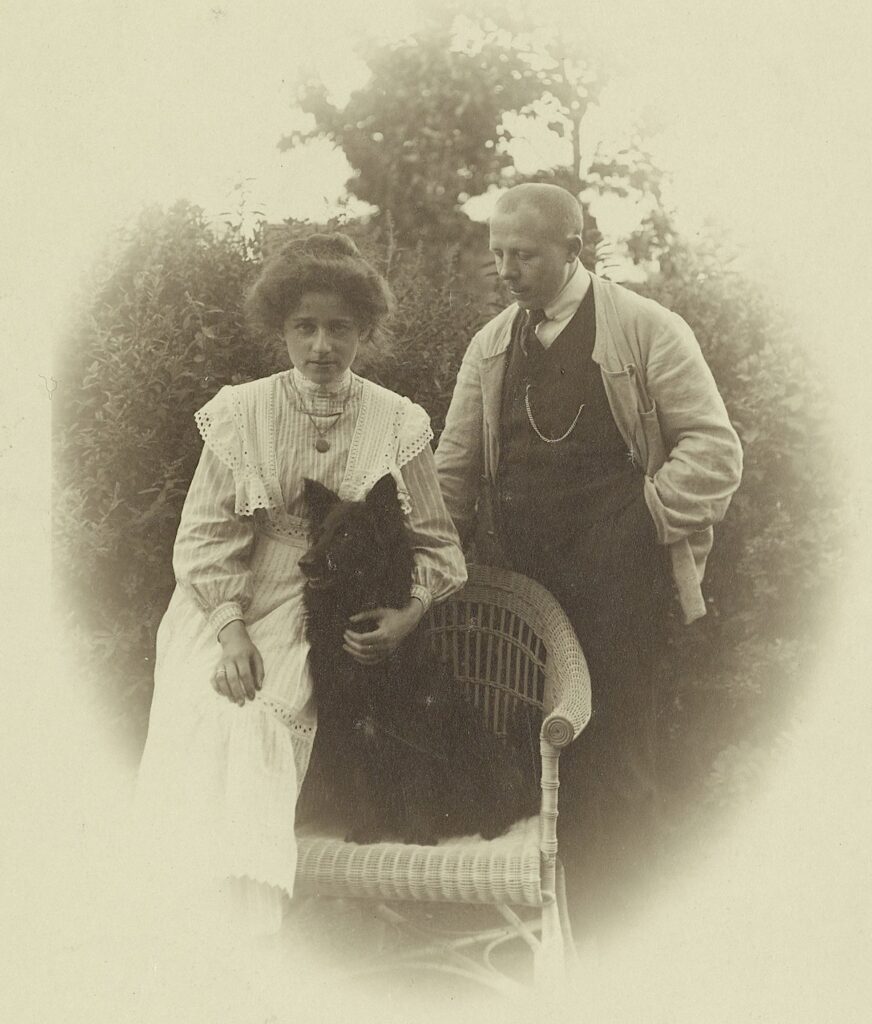 photo of a man, woman and dog