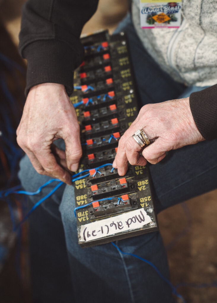 Close up of hands holding electrical equipment