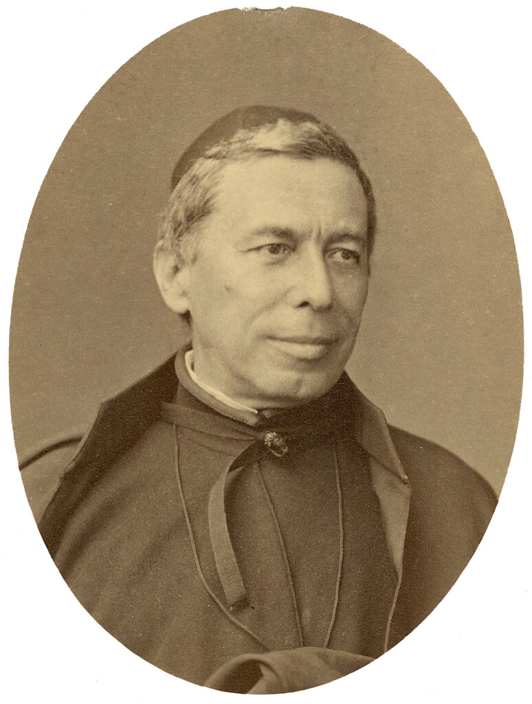 Black and white portrait of man in clerical clothing