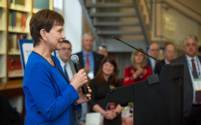 woman speaking at podium