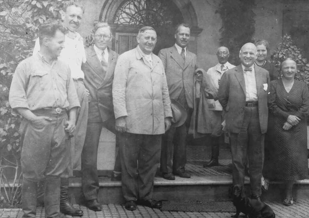 Black and white photo of a group of people outside