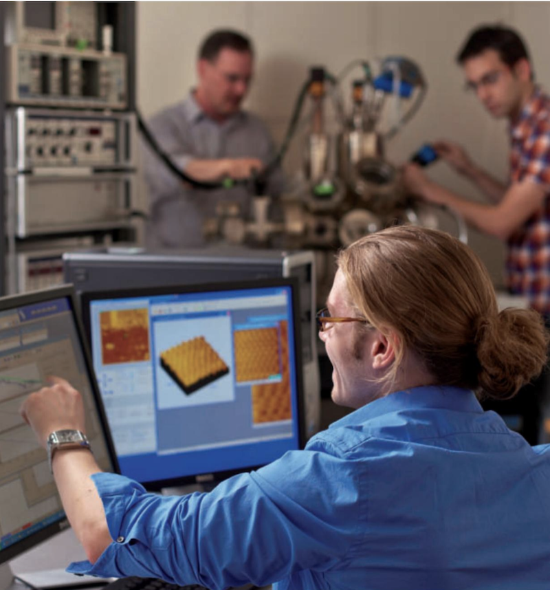 man at a computer screen in a lab