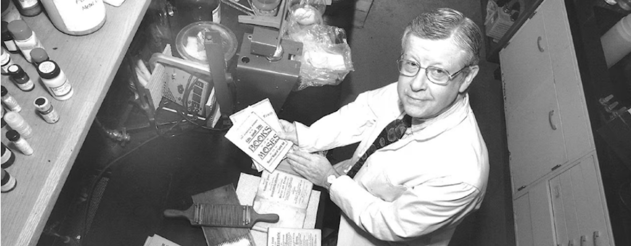 Ned Heindel with parts of his old medical collection including blood letting device and pill roller