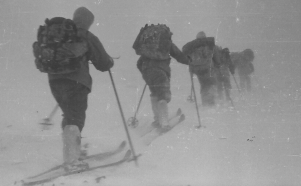 Black and white photo of explorers on cross country skis