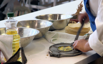 person making tacos